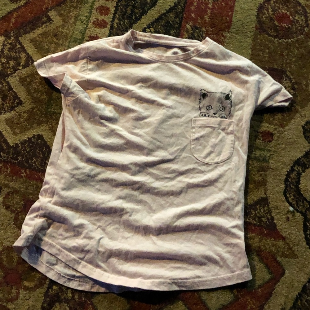 a pink shirt with a small pocket design with kit